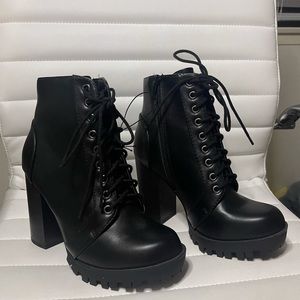 Black heeled combat boots lace and zipper